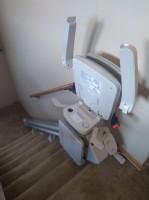 Bruno Elan stairlift with components folded up at top landing in Wintrhop Harbor IL