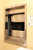 commercial dumbwaiter with doors sliding open in Lombard senior living facility