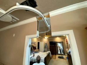 ceiling lift track allowing transfer from bedroom to bathroom