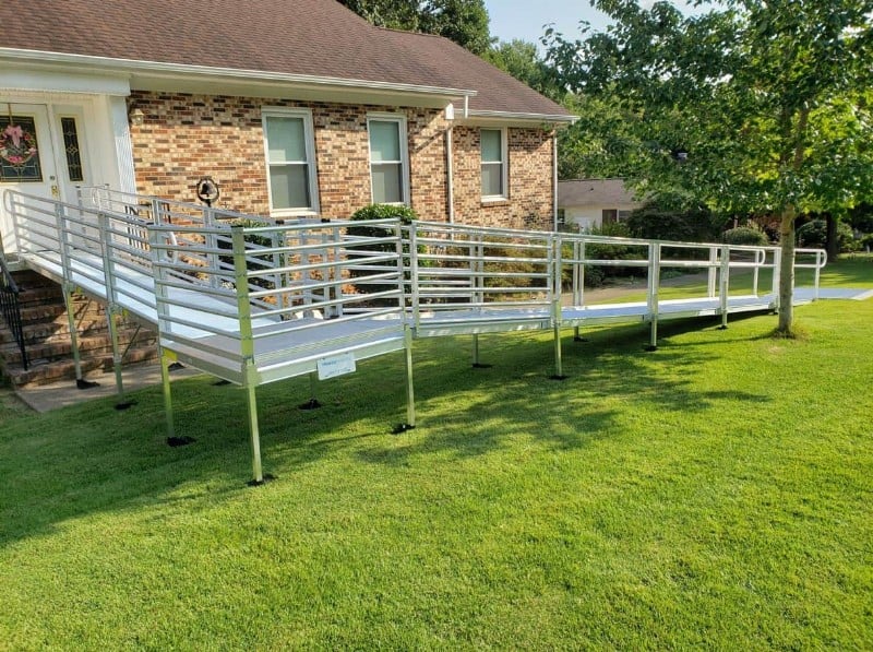 aluminum wheelchair ramp with horizontal guard rails installed by Lifeway Mobility