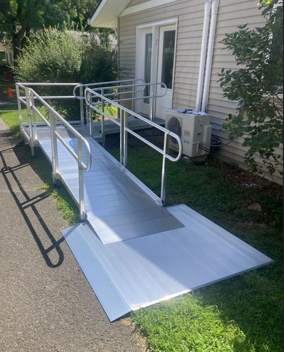 aluminum wheelchair ramp providing safe access at to front of home