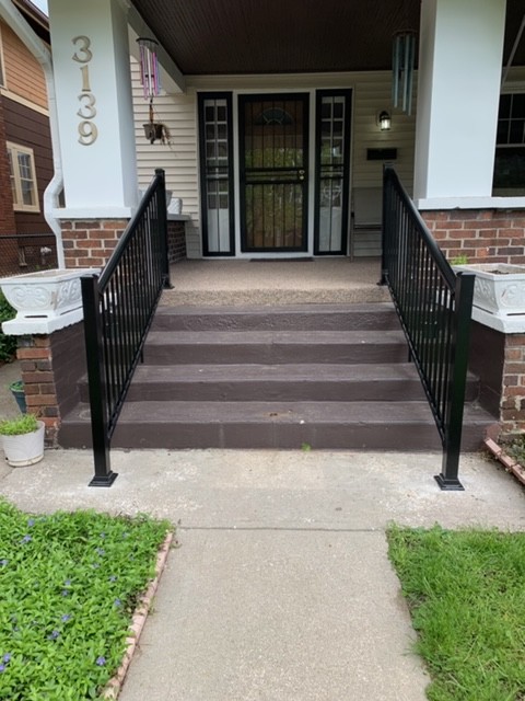 pair-of-handrails-on-outdoor-staircase-for-front-door-access.JPG